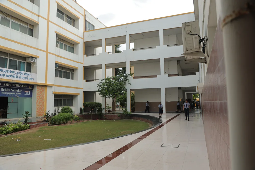 The courtyard, its lawn and young trees