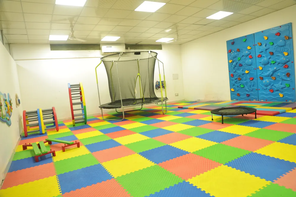 The trampoline and the climbing wall in the soft-play hall