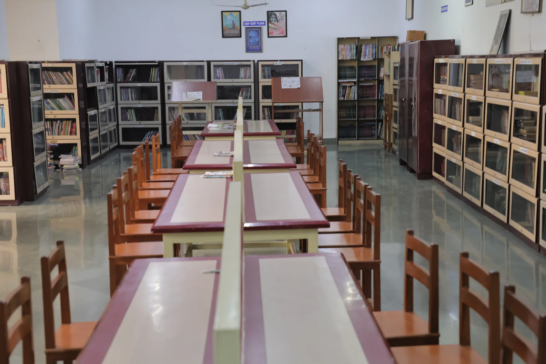The senior library, its long tables and stacks