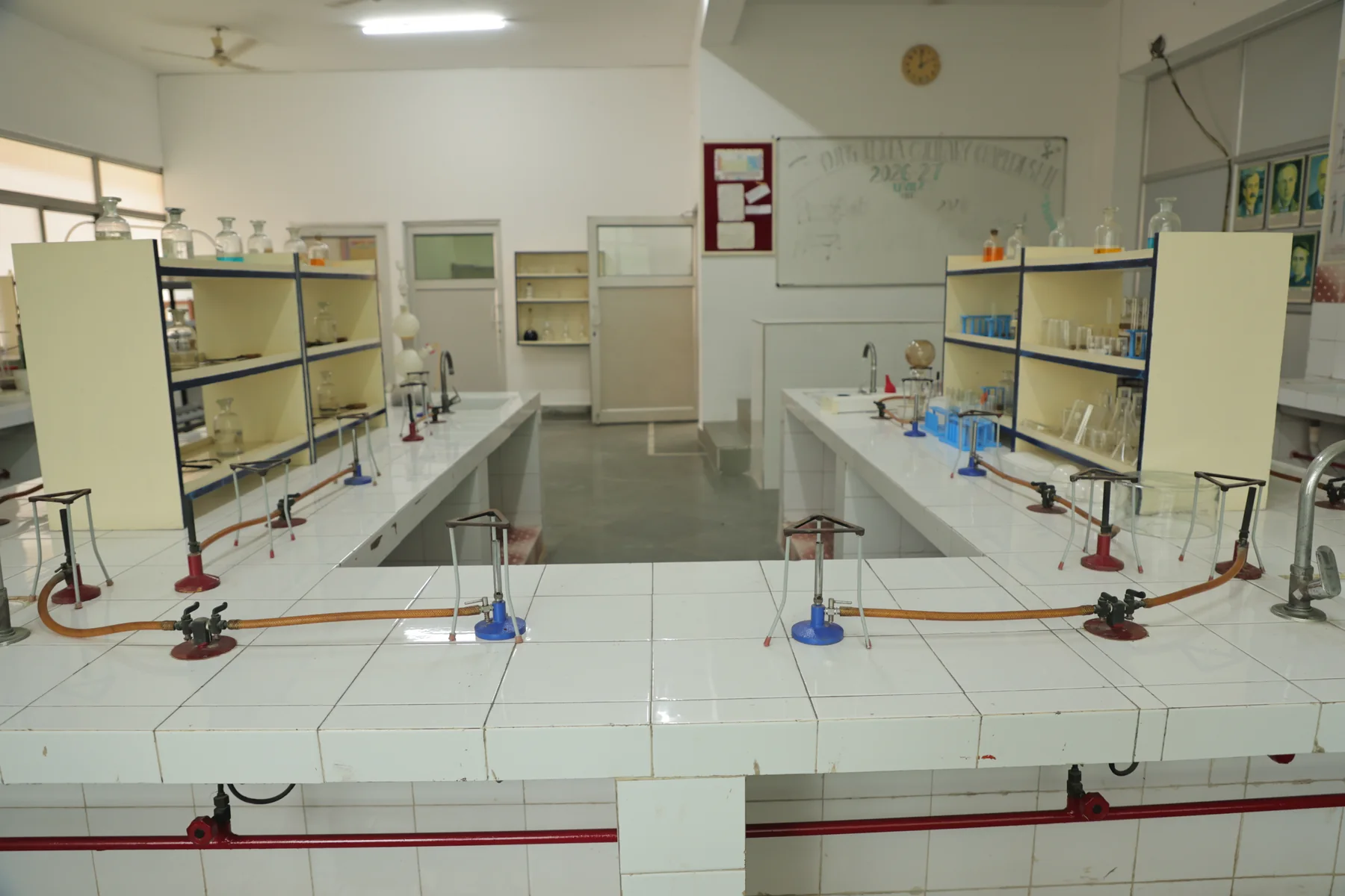 The chemistry laboratory, benches and reagent shelves