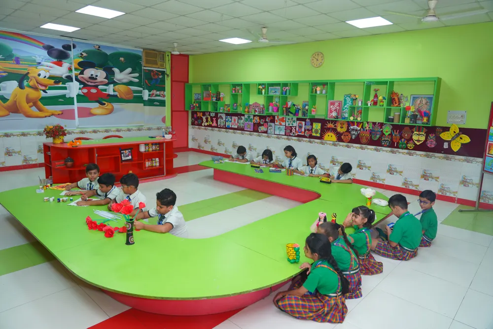 Pre-primary learners at colourful tables in the NIMBUS block