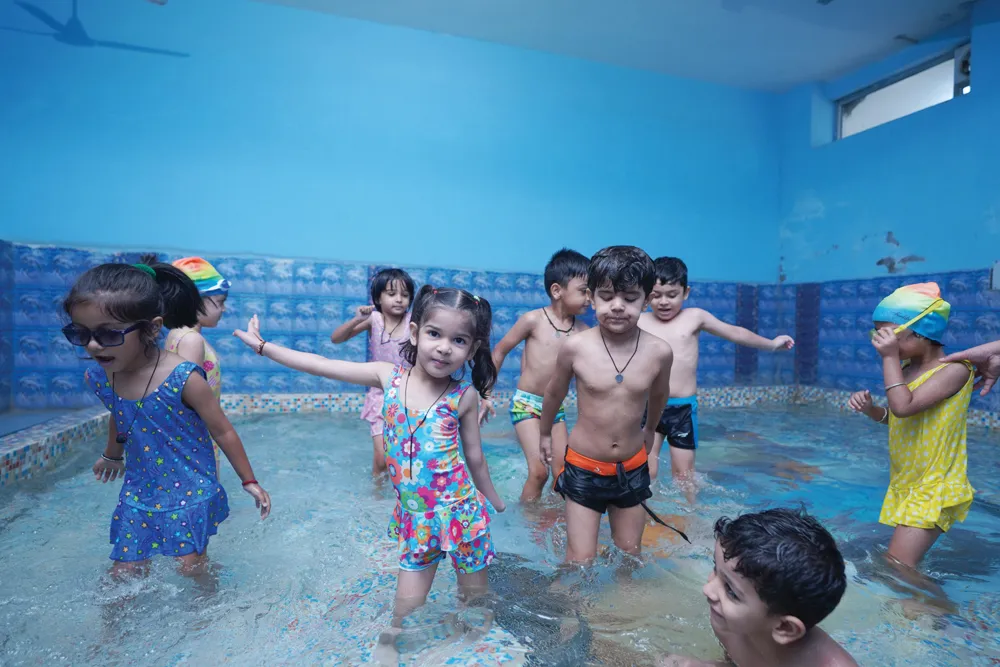 Children playing in the small pool for kids