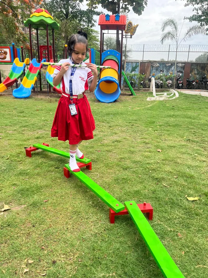 A child on the see-saw in the school lawn