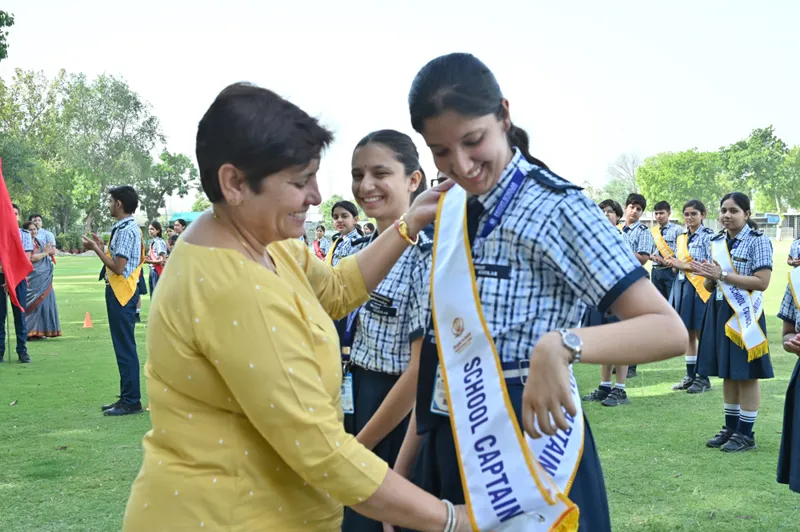 Investiture ceremony — sash presentation