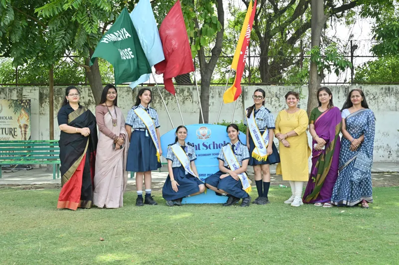 The student council with house flags at the investiture ceremony